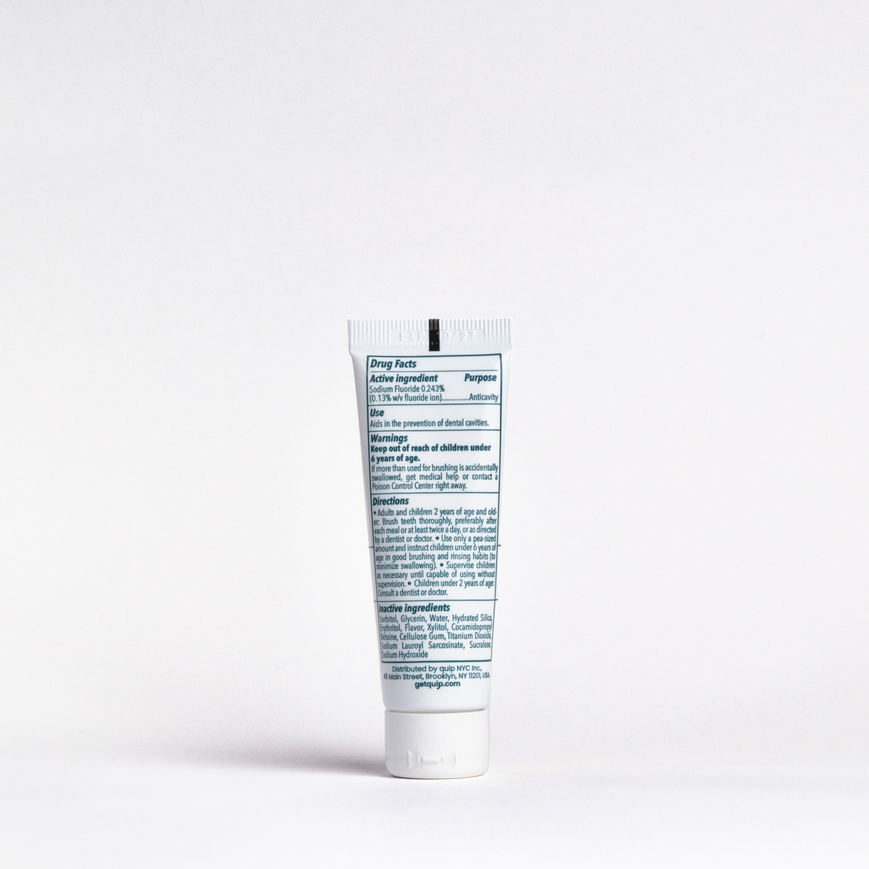 Tube of toothpaste with text on a white background