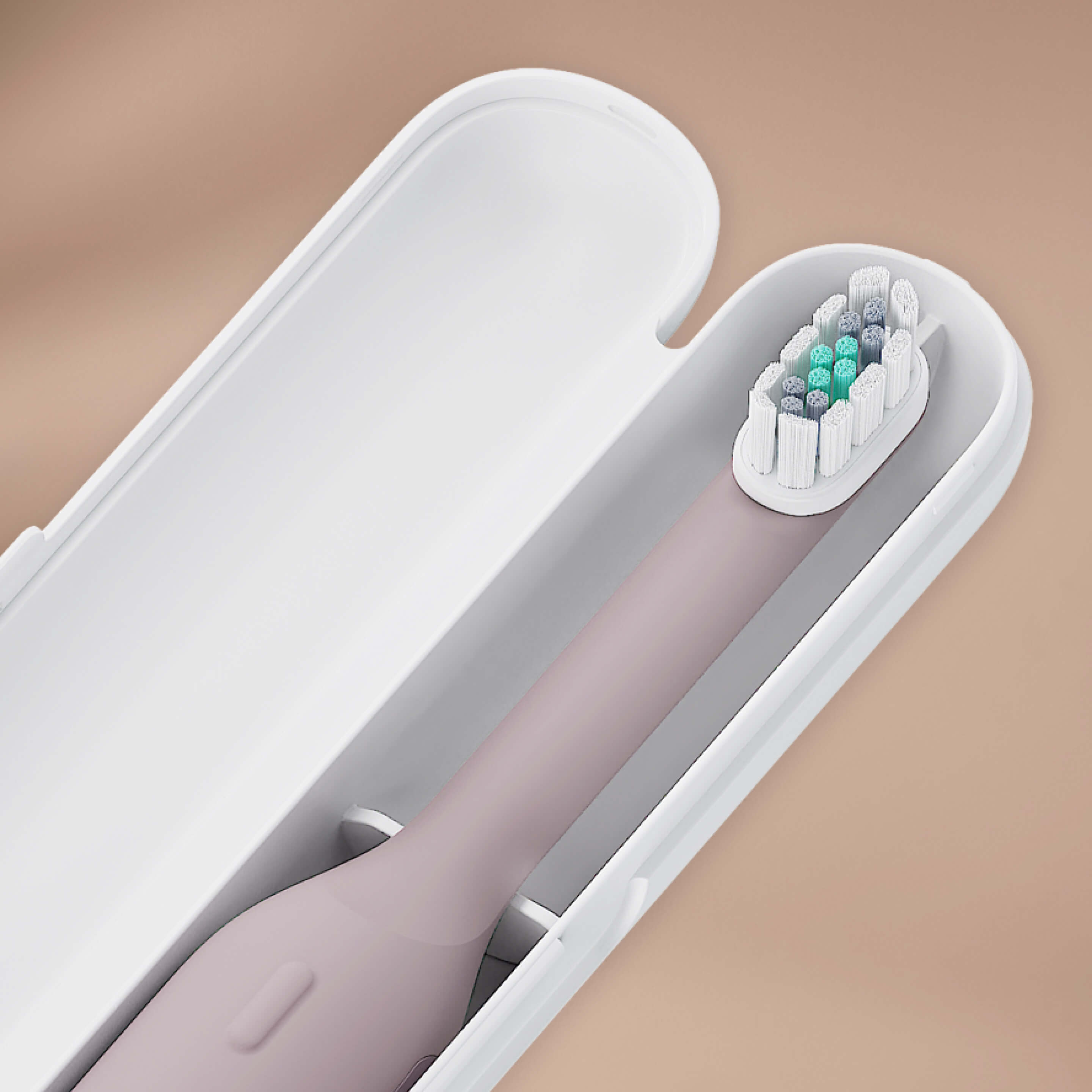 Electric toothbrush with travel case on a beige background