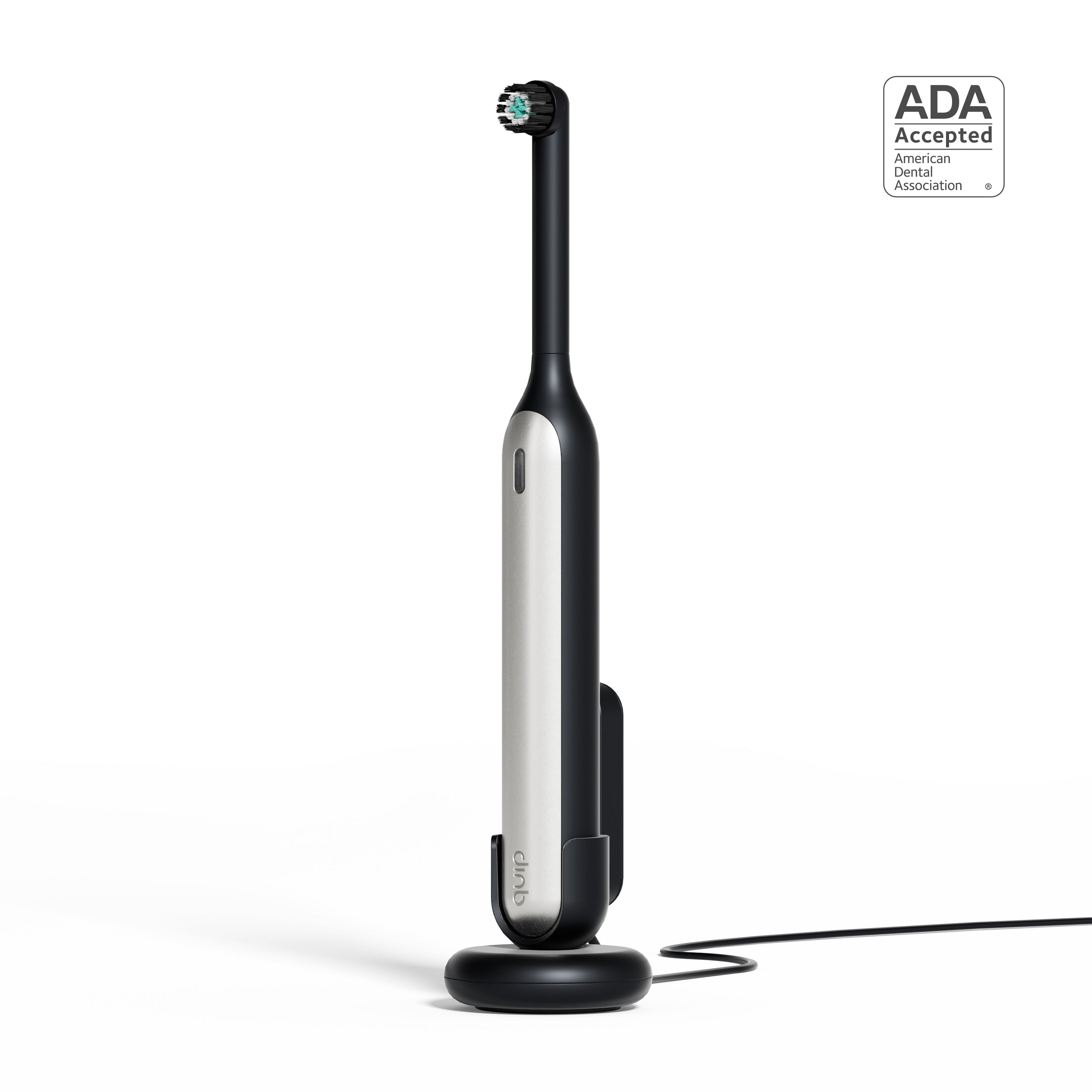 Rev Oscillating Toothbrush in Gray Shadow standing upright on its charging base, featuring a sleek modern design with an ADA Accepted badge displayed beside it.