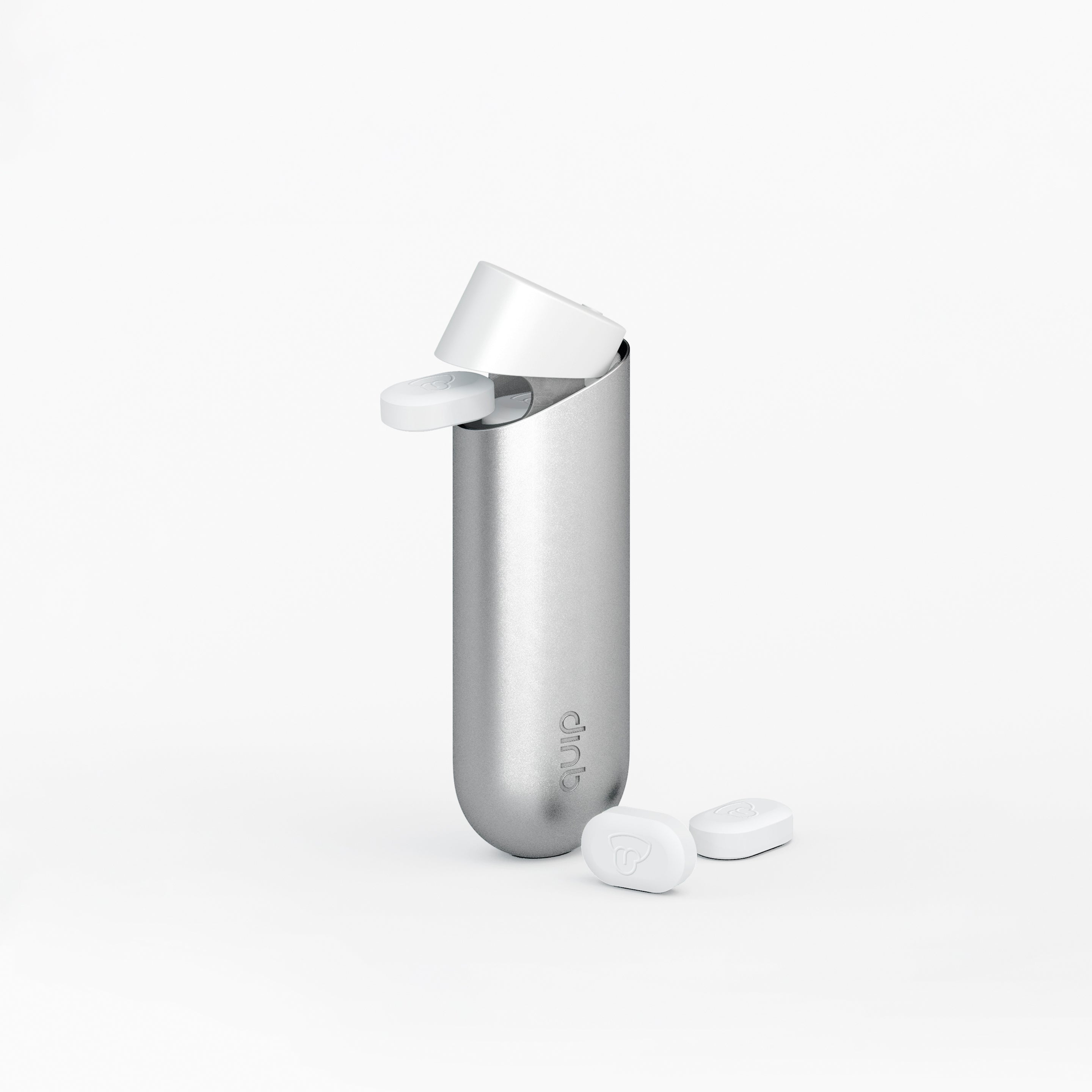 quip mint dispenser in silver dispensing a piece of quip mint