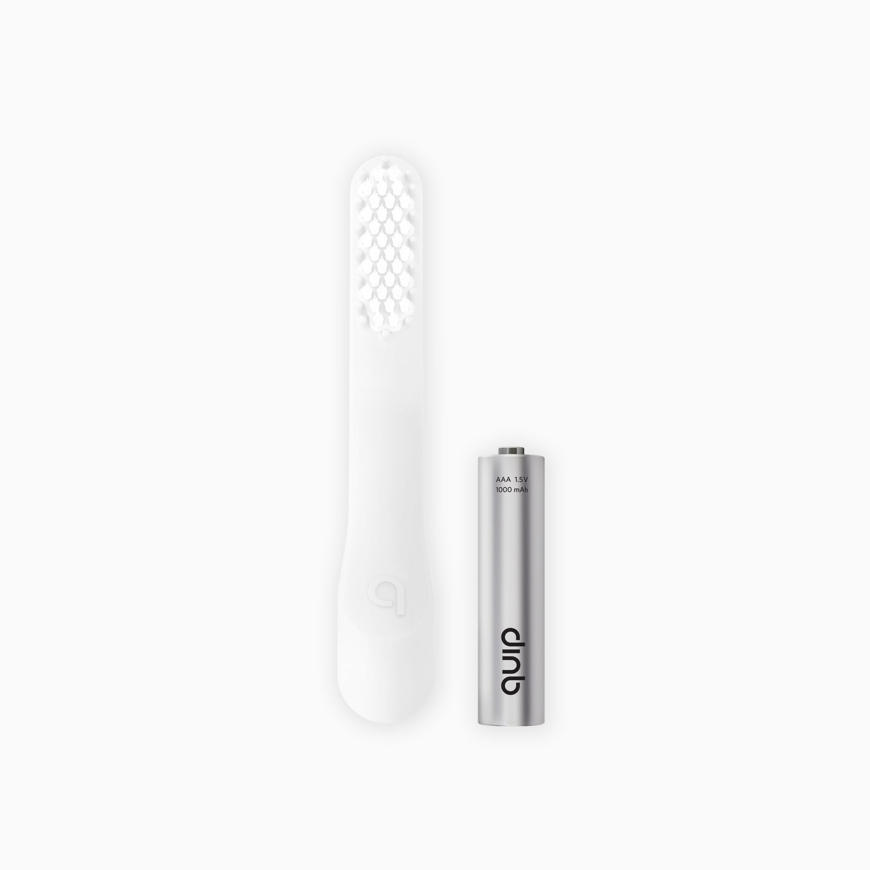 An extra soft brush head refill next to a battery, designed for a sonic electric toothbrush.
