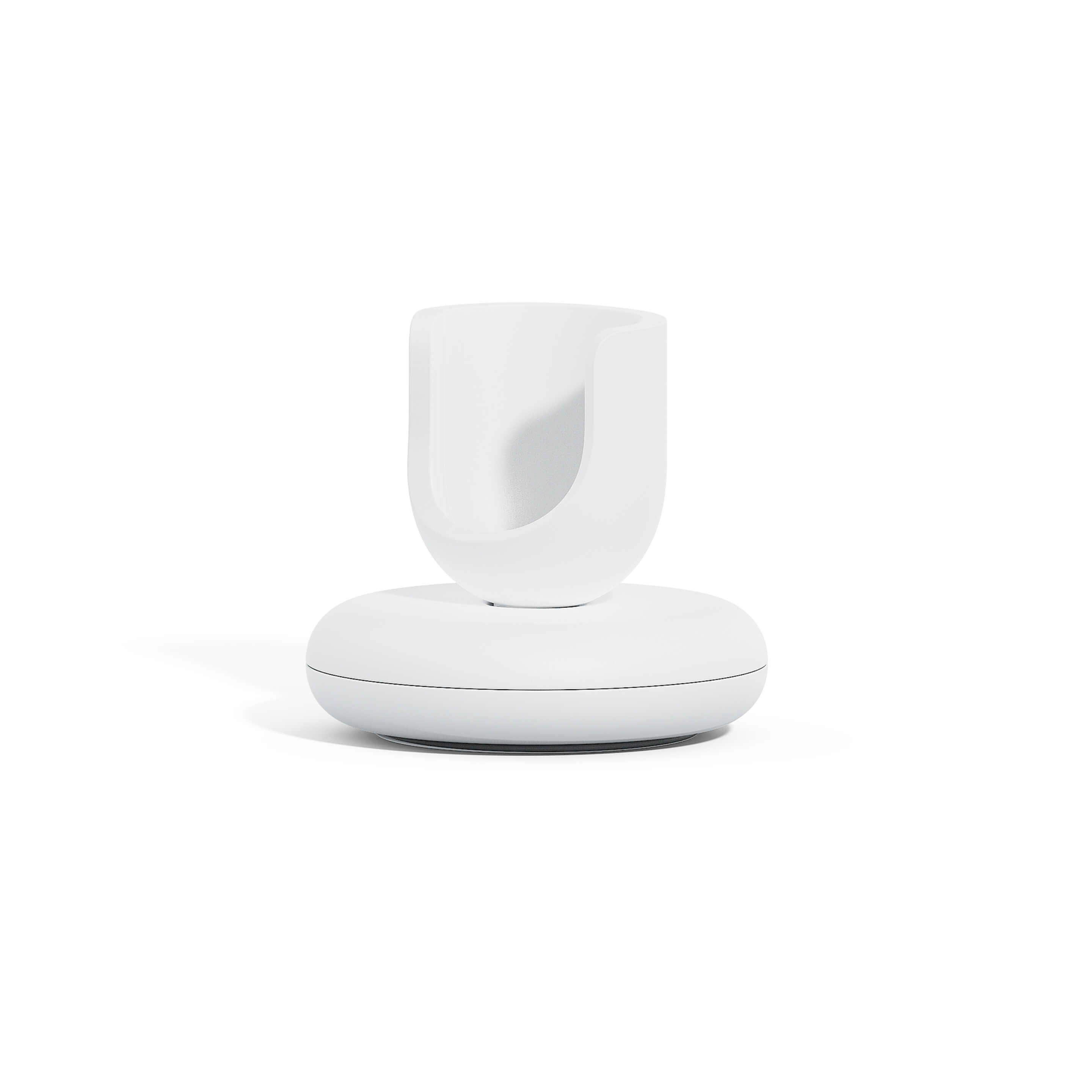 A white toothbrush stand designed for the quip Ultra Smart Sonic Toothbrush, featuring a weighted base and a rubber ring for traction.