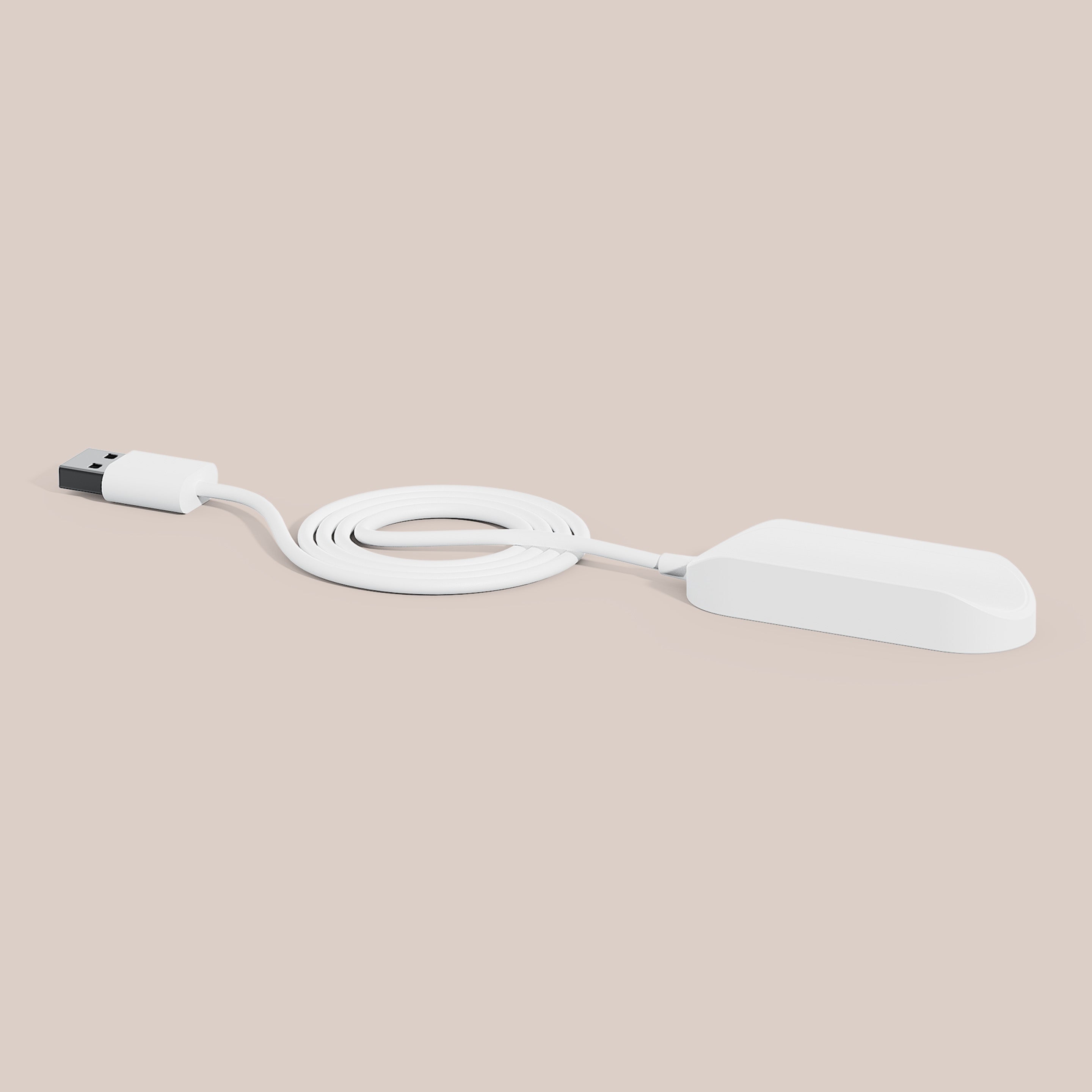 Charger Cable with a sleek white magnetic base and USB connector for the Ultra™ toothbrush.