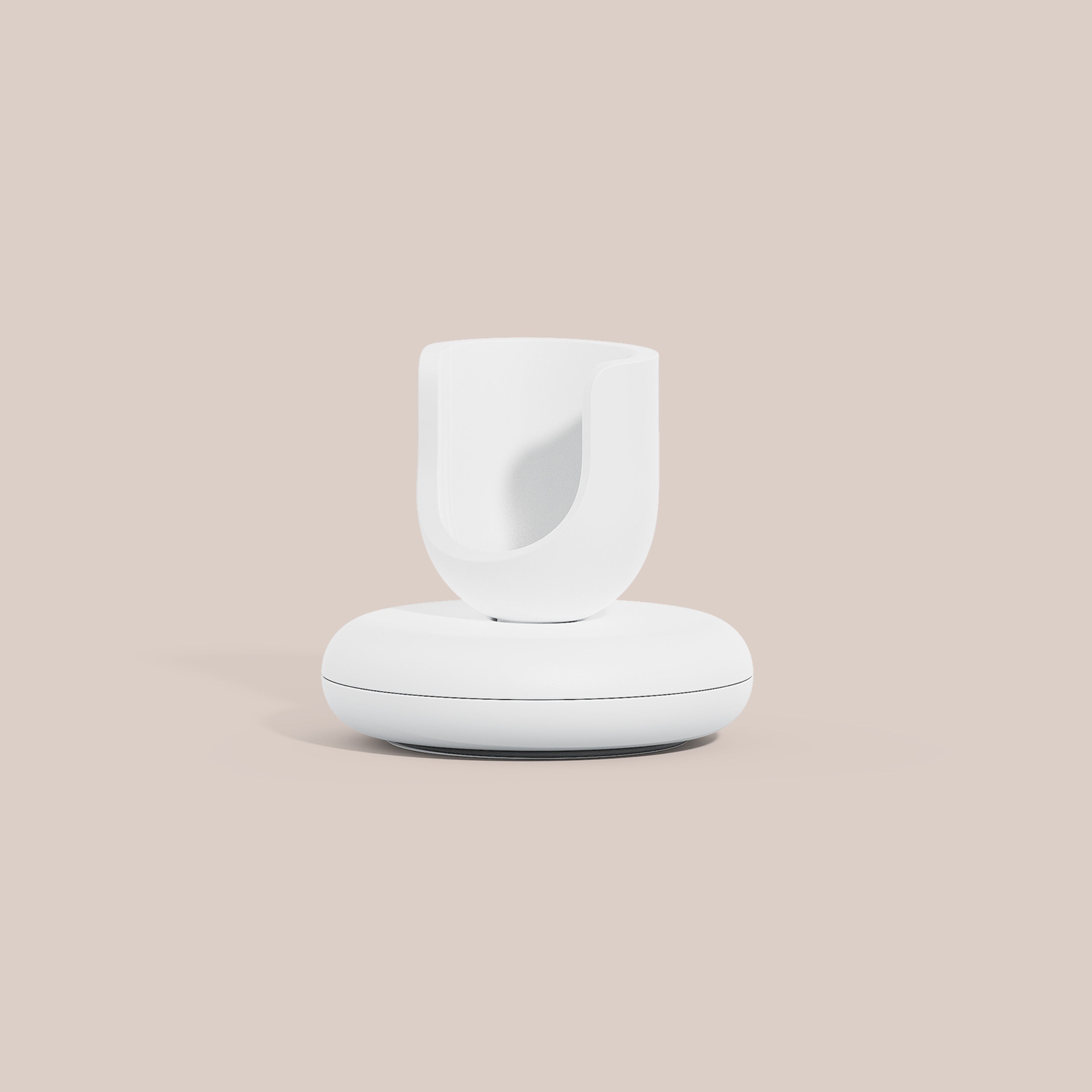 Stand in white with a rounded base and smooth holder designed to keep the Ultra™ toothbrush upright and organized.