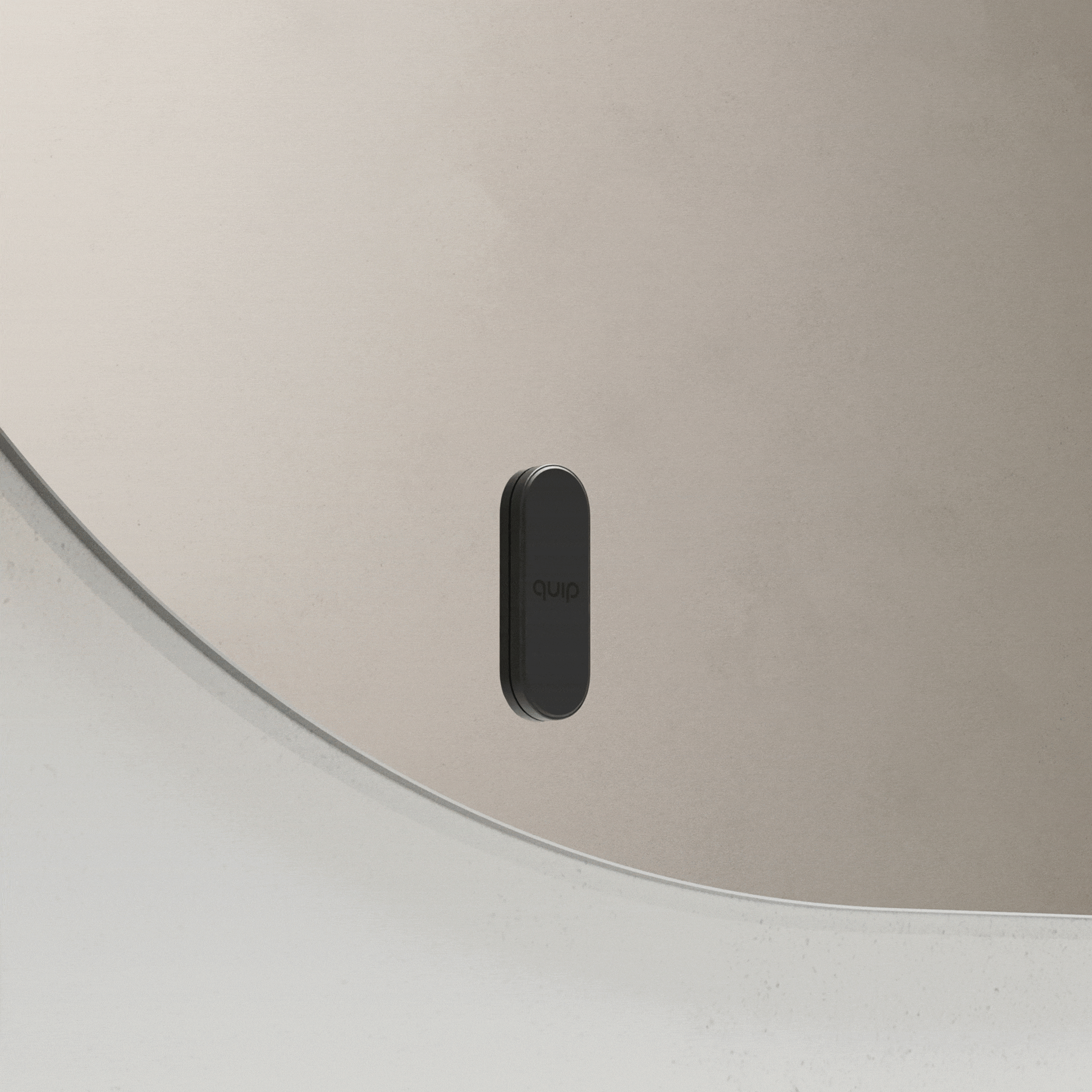 Black quip toothbrush mount attaching to and releasing from a bathroom mirror.
