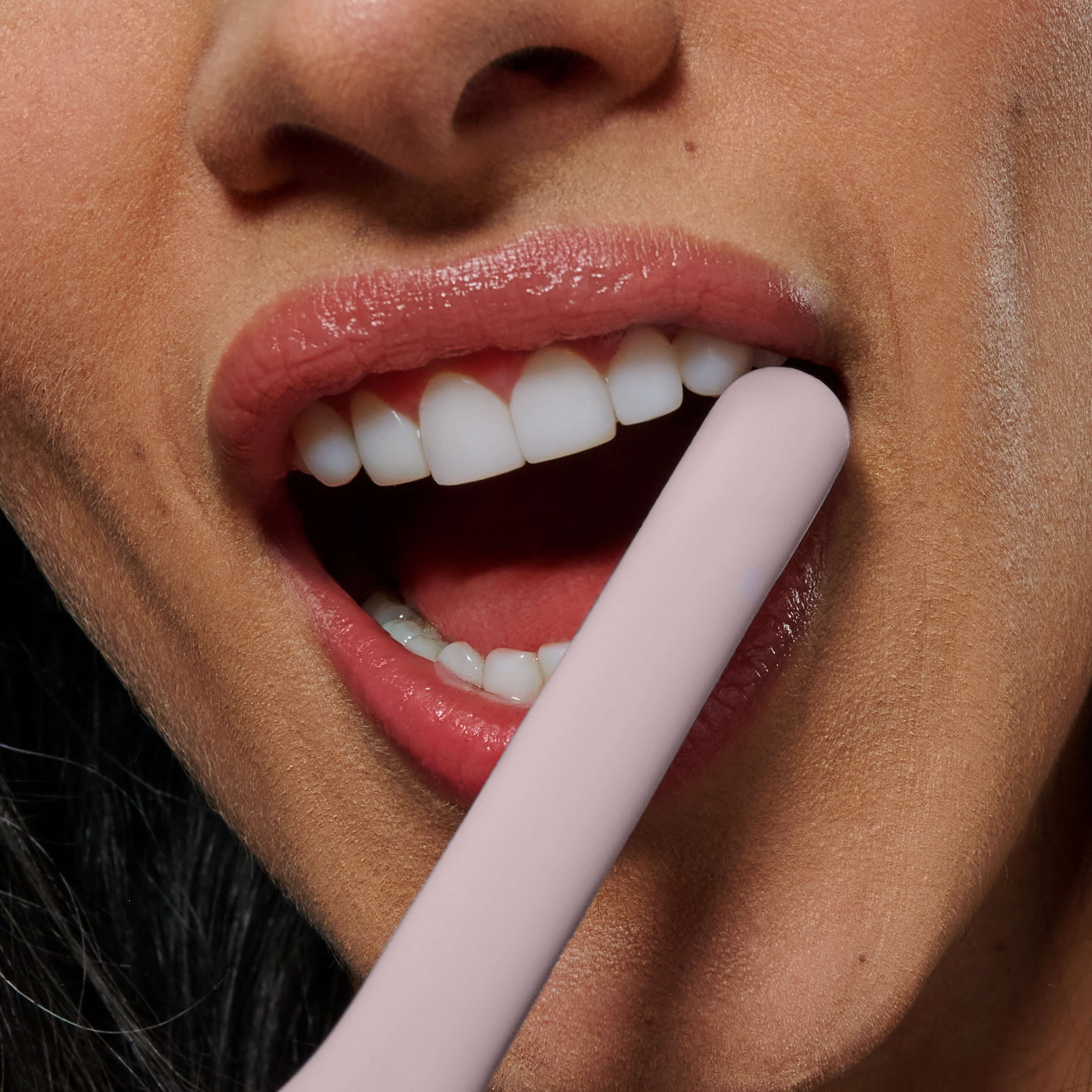 Person brushing teeth with Ultra™ Smart Sonic Electric Toothbrush in Stone.