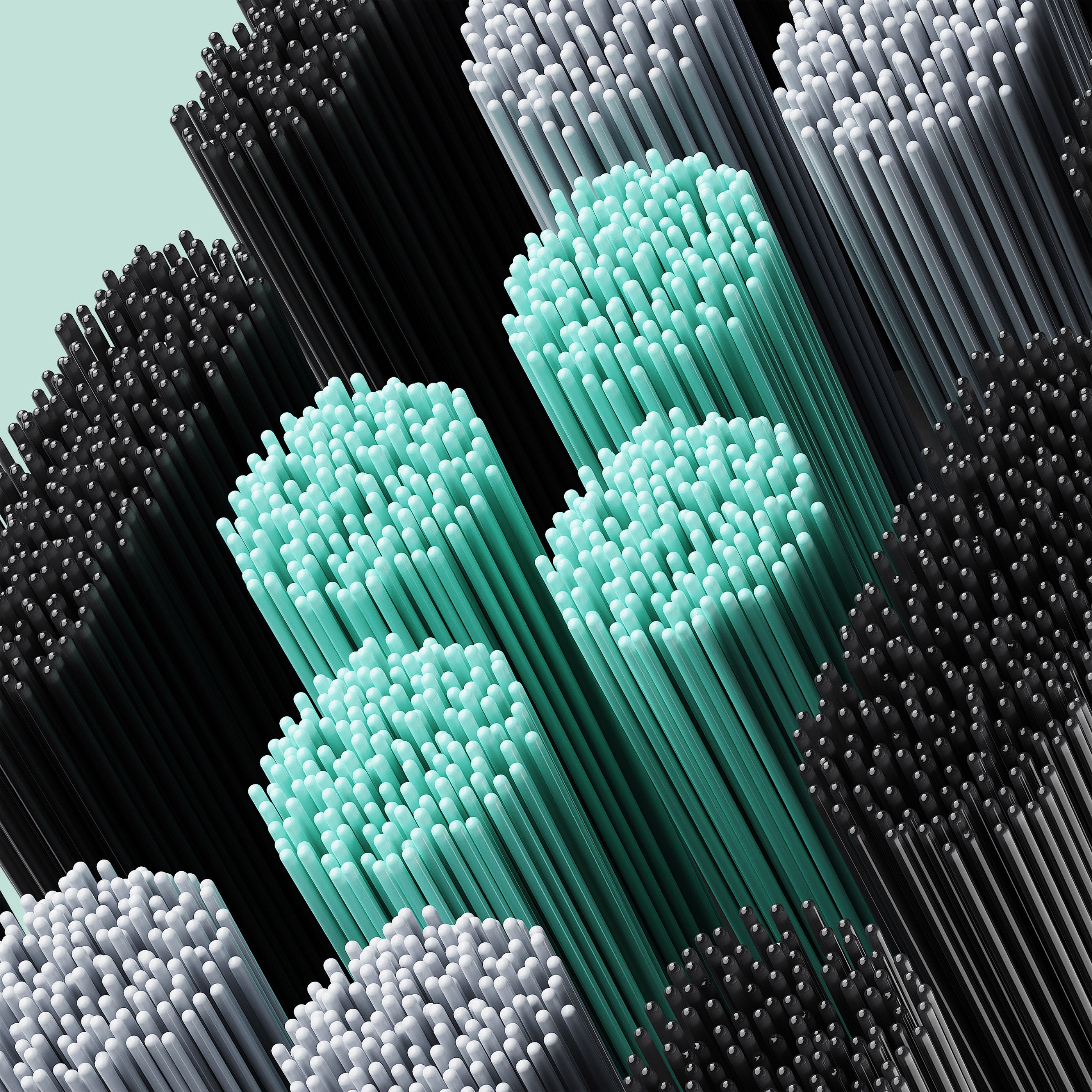 Close-up of densely packed toothbrush bristles in black, gray, and mint green clusters.