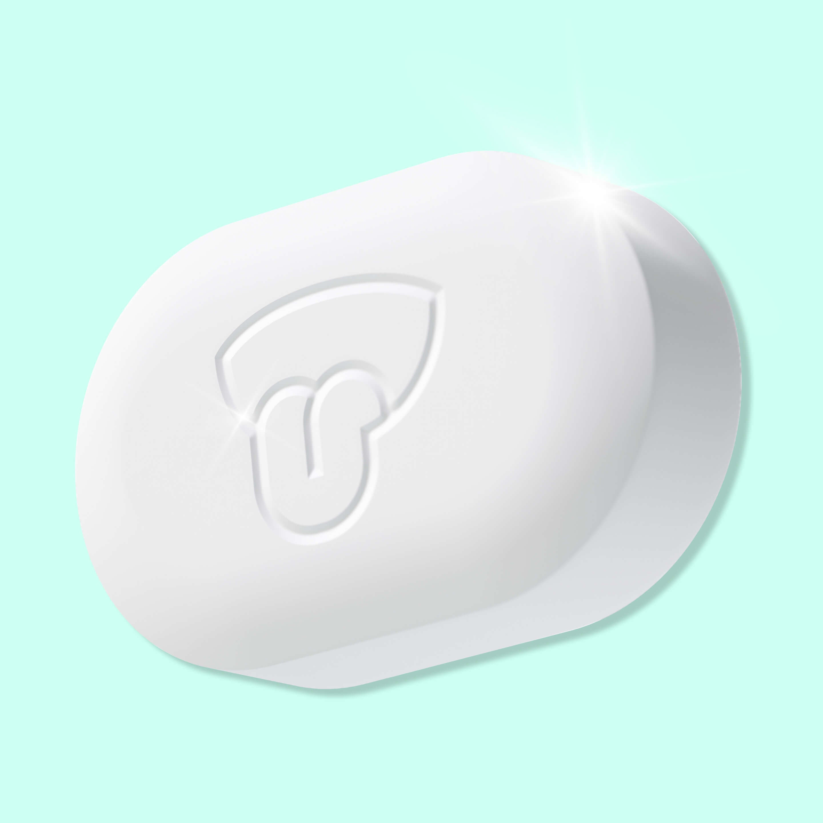 White soap bar with a logo on a light blue background