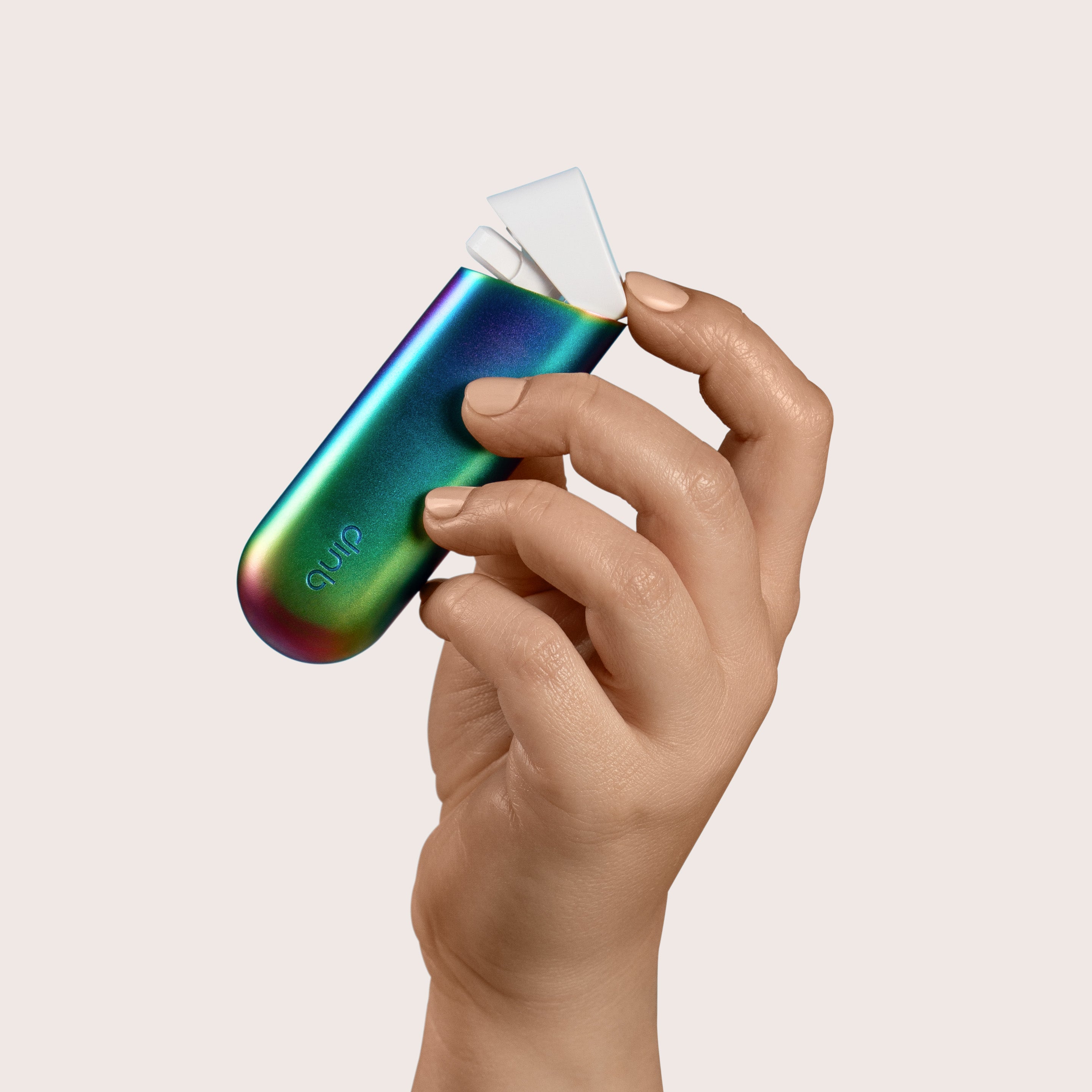 Hand holding a colorful vape device with 'Glow' branding on a beige background