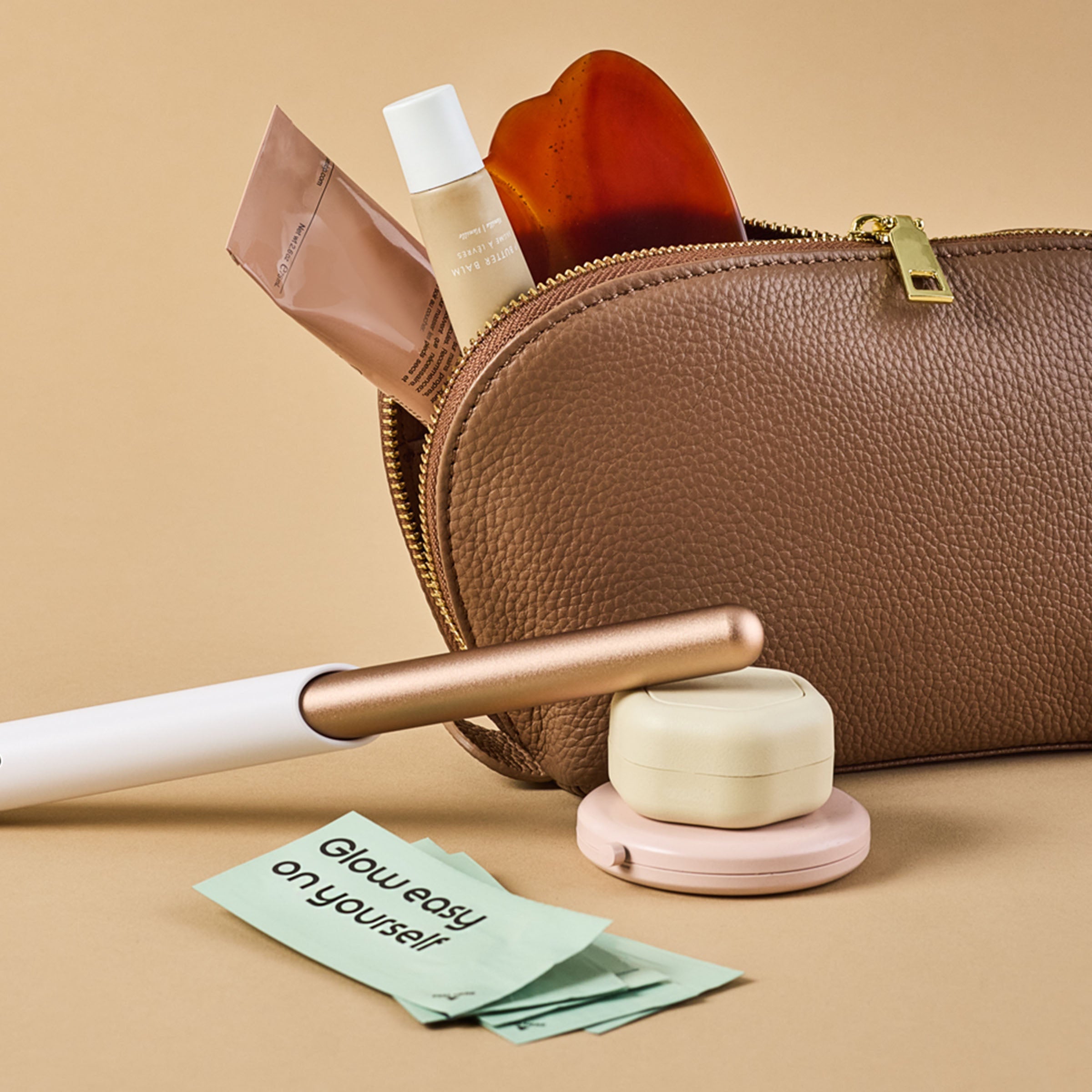 Cosmetic bag with beauty products on a beige background
