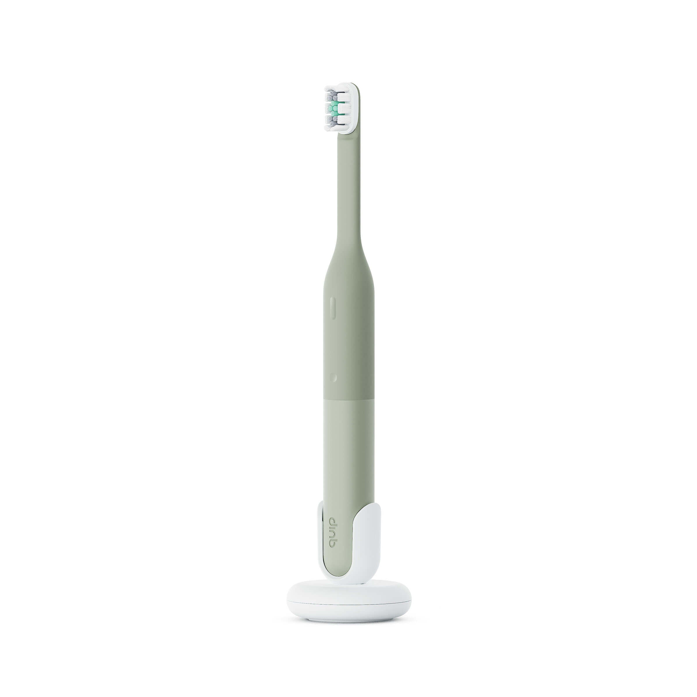 Green electric toothbrush with white base on a white background