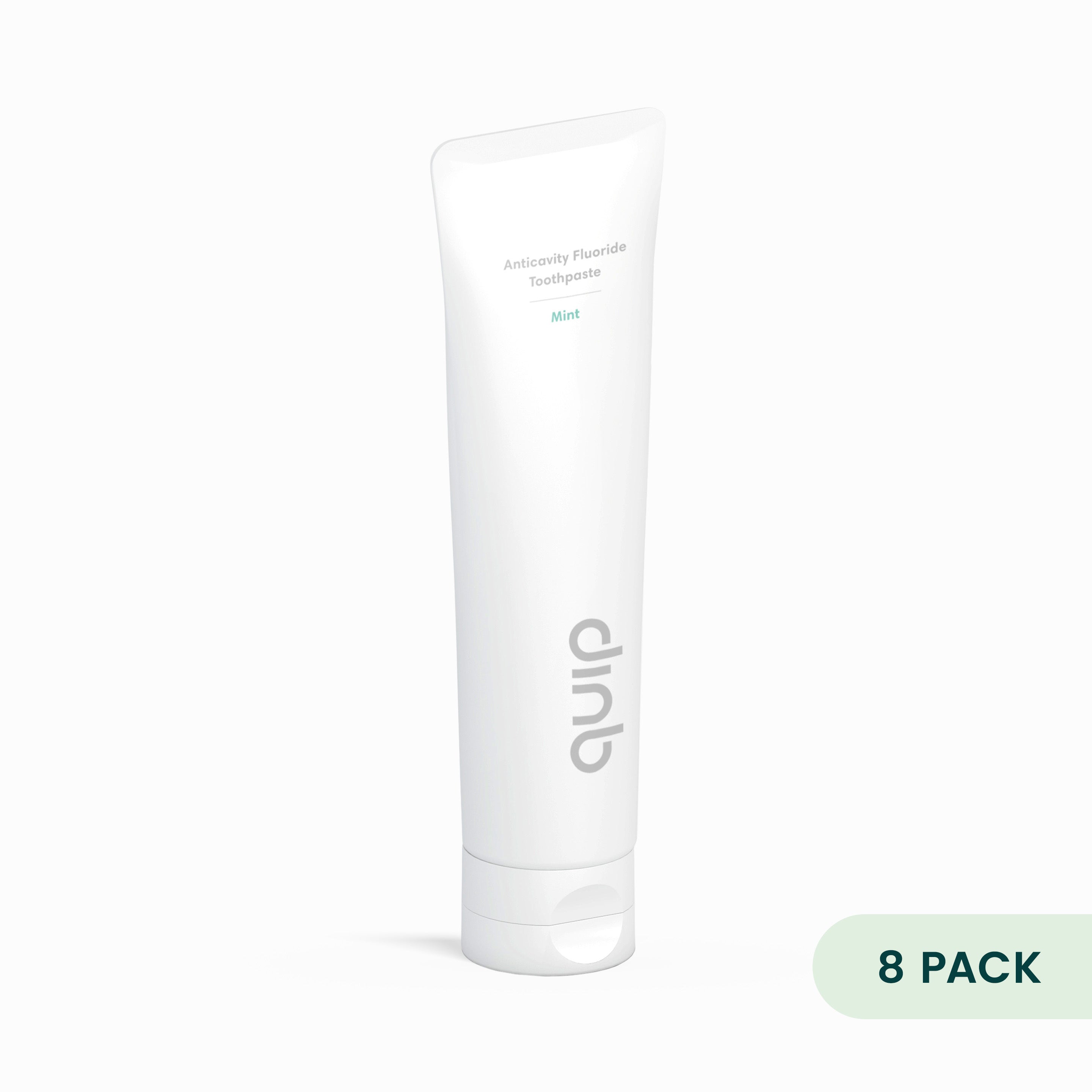 White tube of quinb toothpaste on a white background with '8 Pack' label.