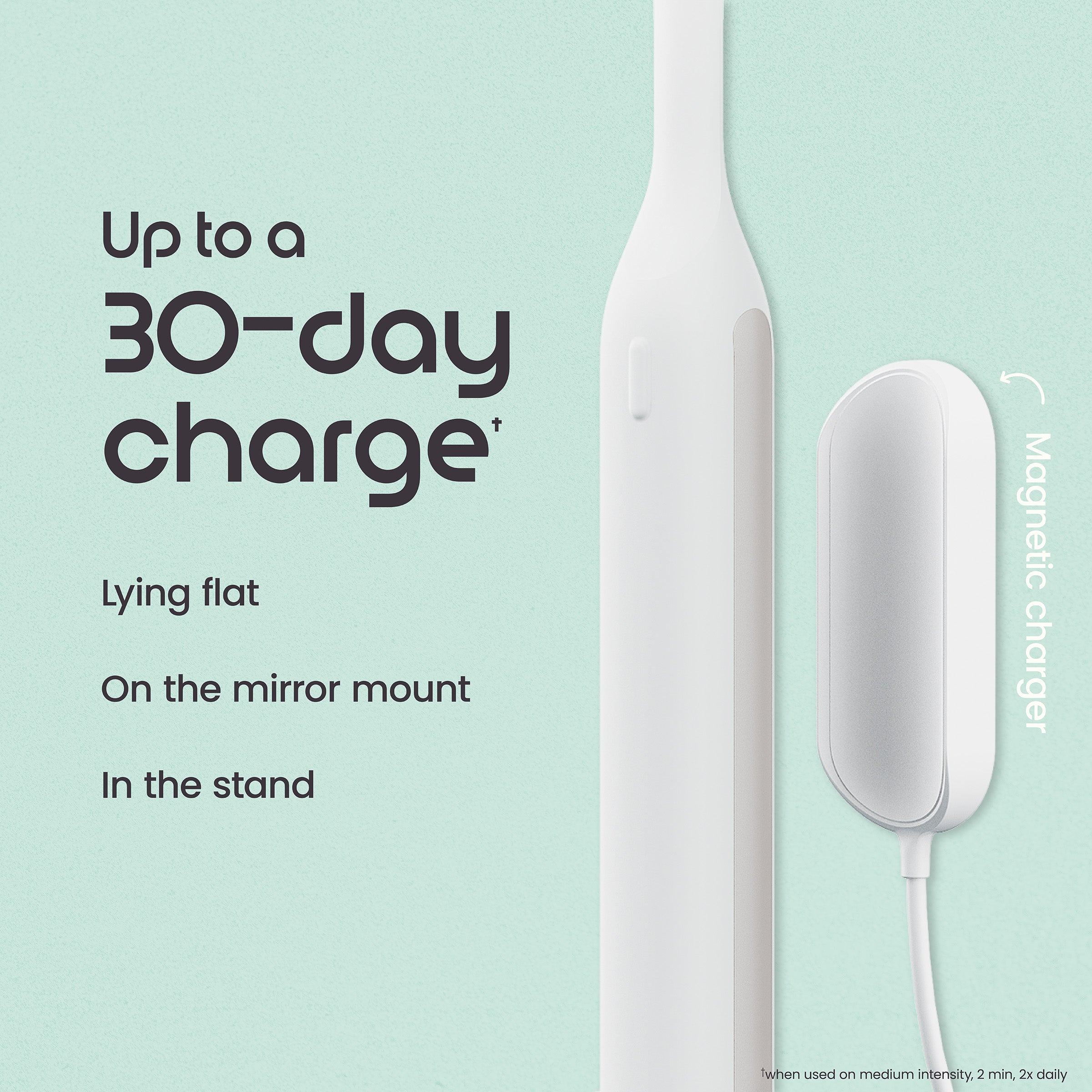 White electronic device with charging stand on a light green background, featuring text about charging capabilities.