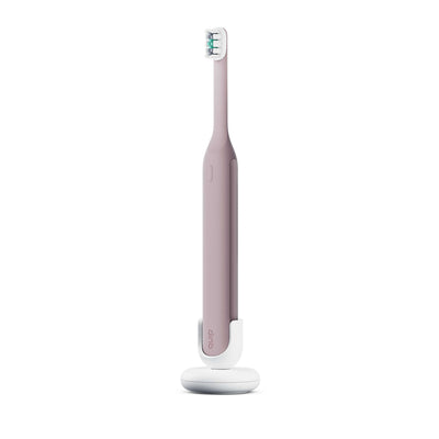 Ultra™ Next Generation Smart Sonic Electric Toothbrush in Dusk color, shown upright on its matching white stand.