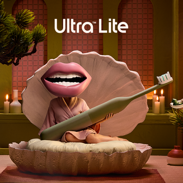 Ultra Lite toothbrush with a shell-shaped head in a bathroom setting