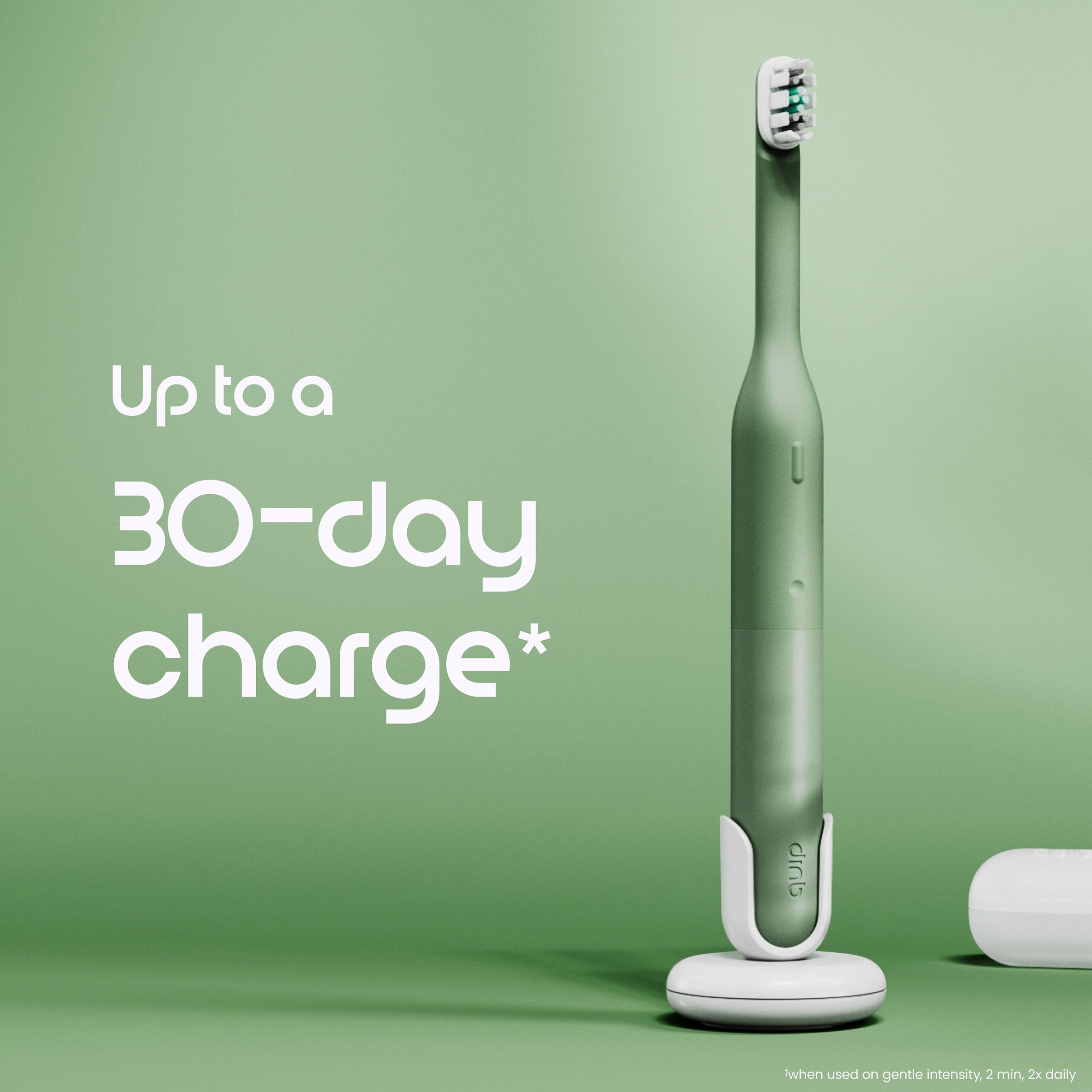 Green electric toothbrush with charging base on a green background, featuring text about charge duration.