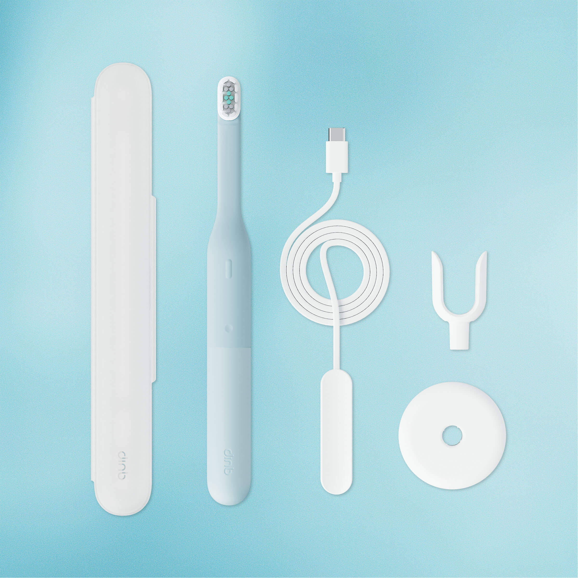 Set of dental care products including a toothbrush, charger, and cleaning tools on a light blue background.
