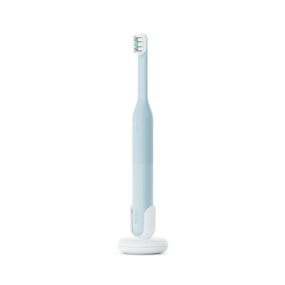 Electric toothbrush with a stand on a white background