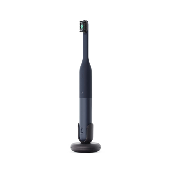 Black electric toothbrush on a white background