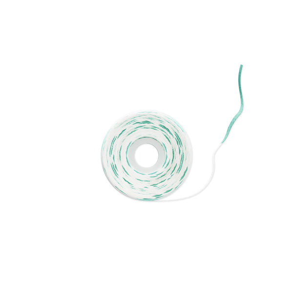 A roll of white twine with thin green stripes, shown on a plain white background with a single strand extending to the right.