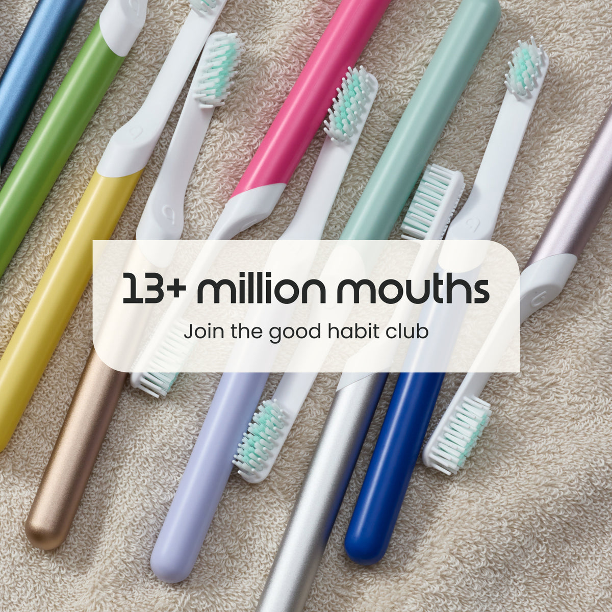 A set of colorful electric toothbrushes arranged diagonally on a beige textured towel, with a semi-transparent white text overlay that reads '13+ million mouths Join the good habit club'.