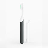 Black and white electric toothbrushes on a white background