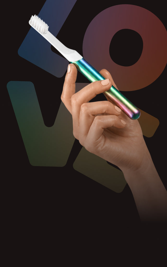 pride banner toothbrush in hand desktop