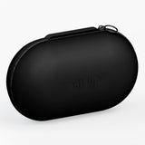 A black oval hard-shell carrying case with a zipper closure and a subtle embossed 'quip' logo on the front, shown on a clean white background.